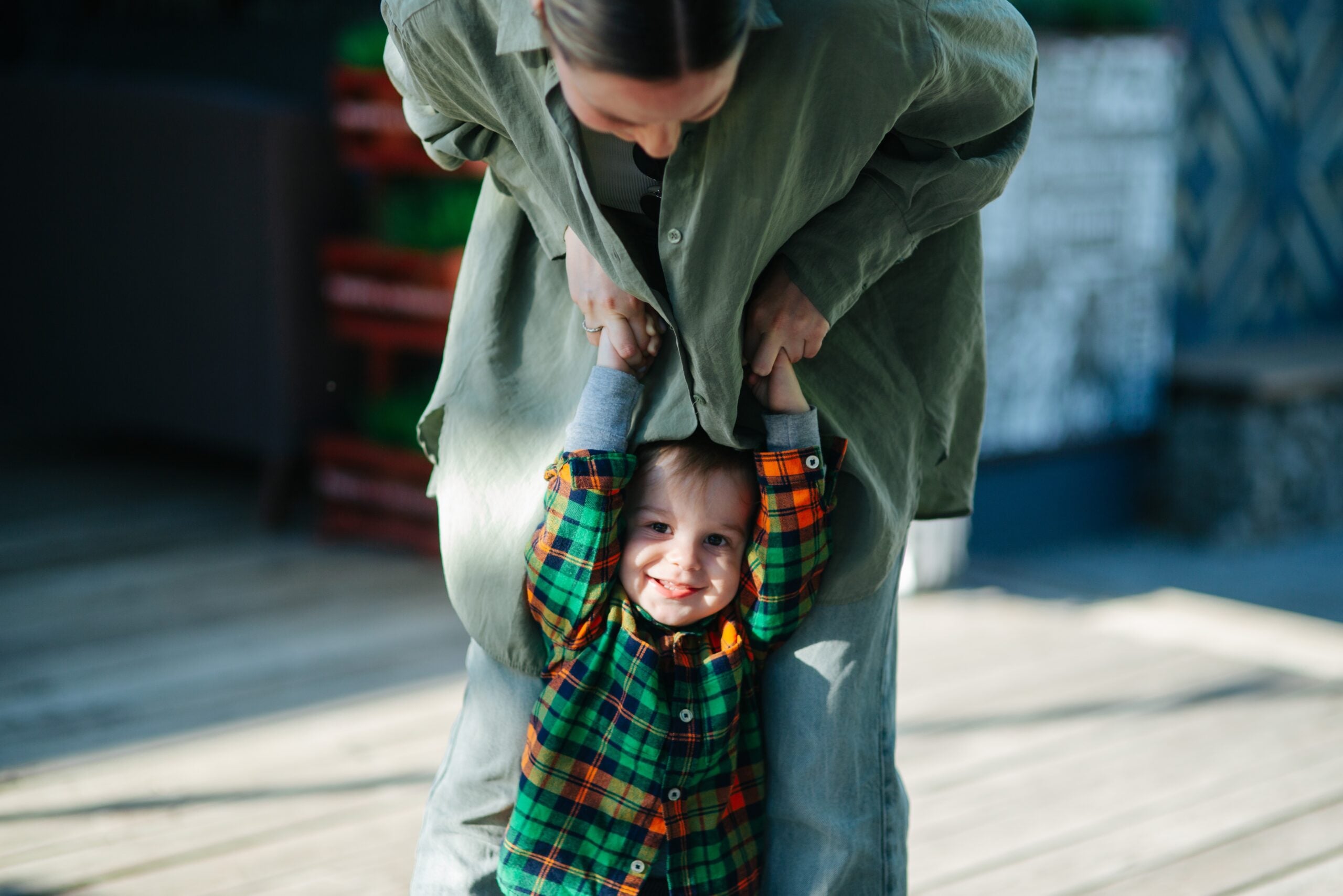 Mom and her toddler son in the park.