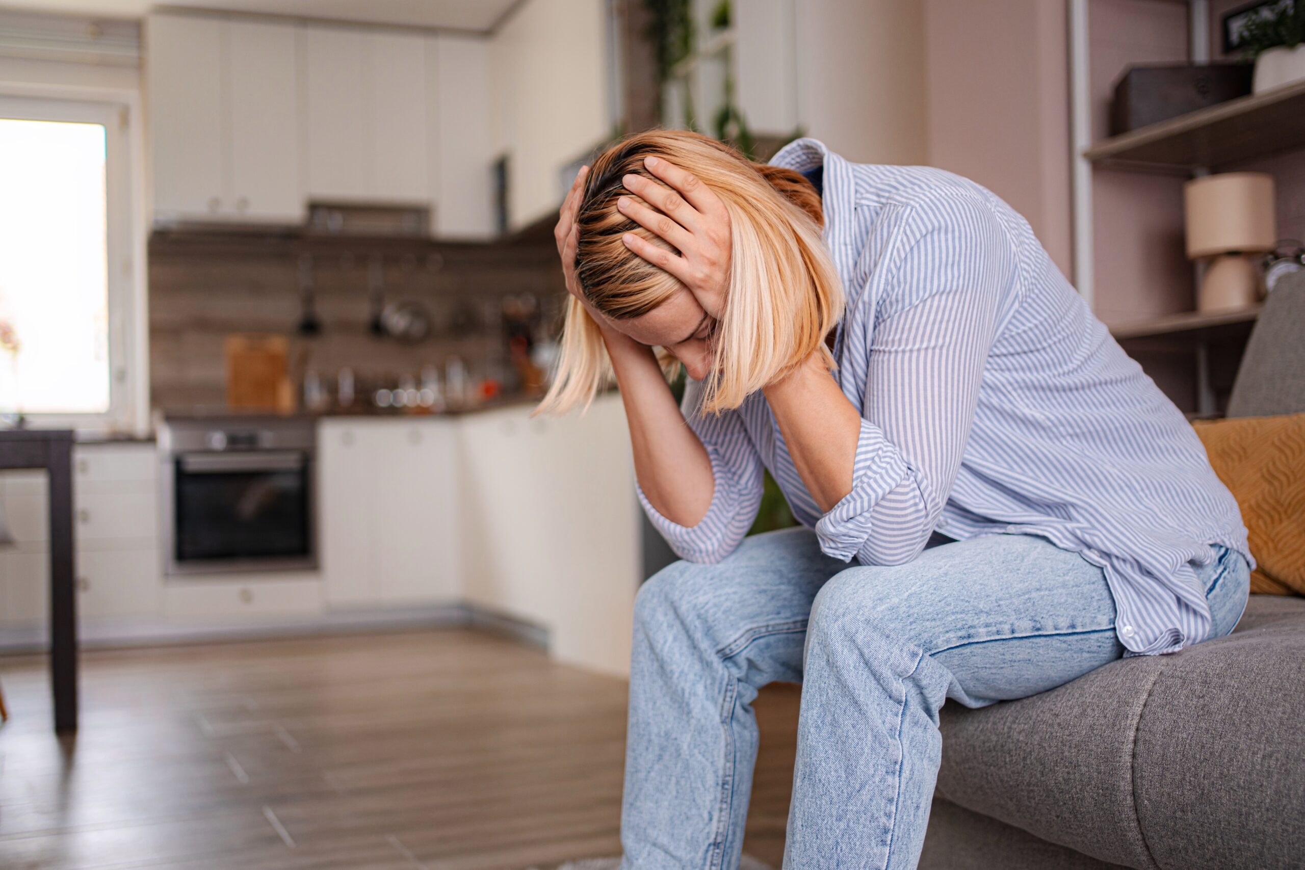 A woman in her kitchen alone missing her children.