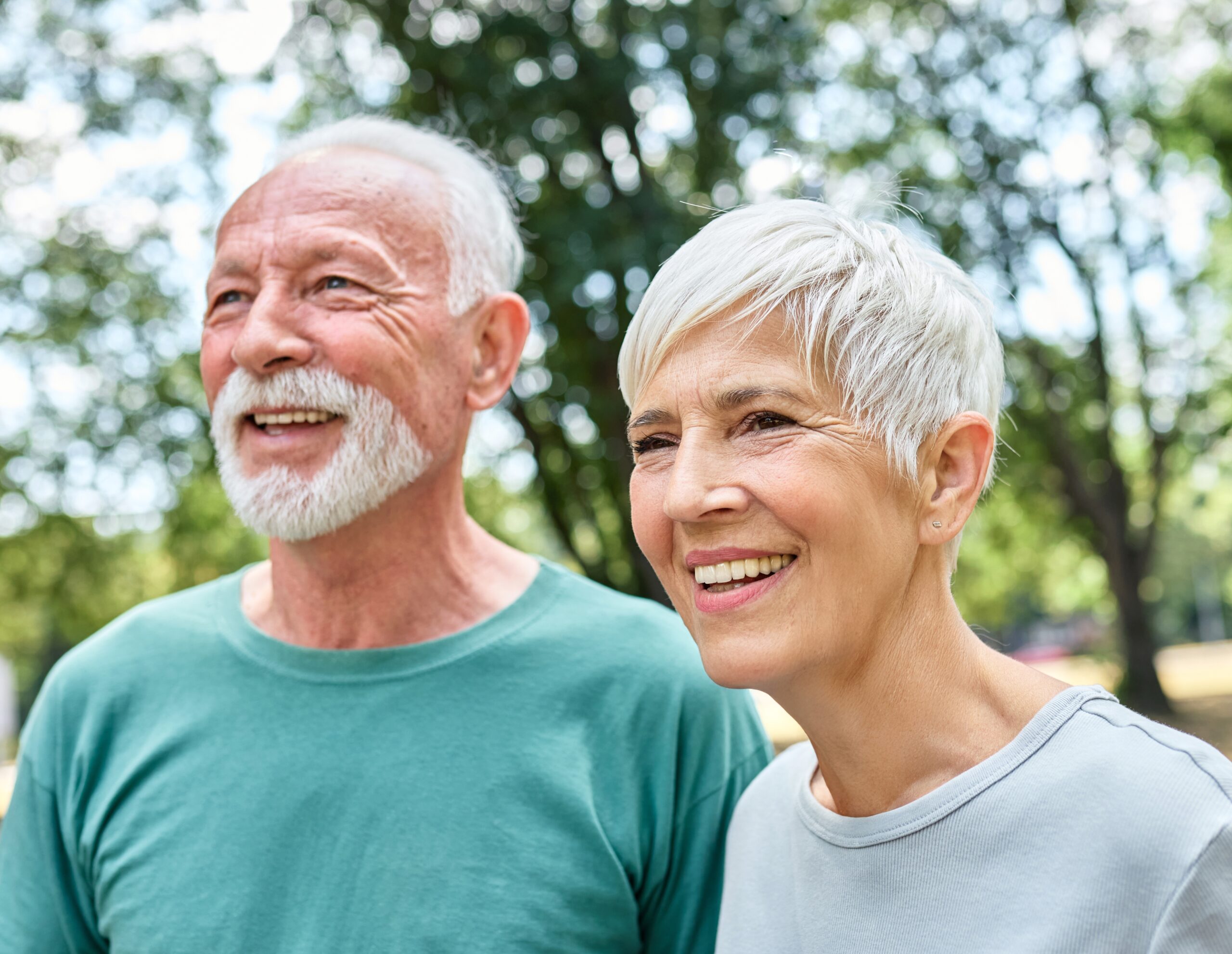 Two active seniors on a walk together.