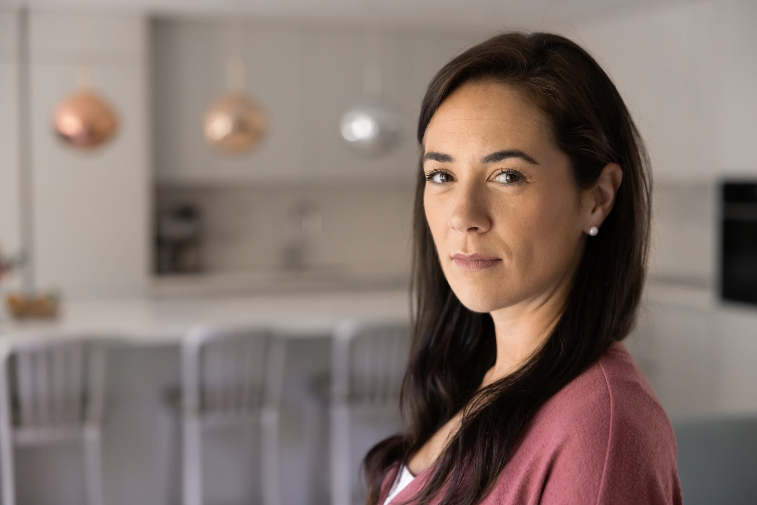Woman in her 40s with an intimidating energy.