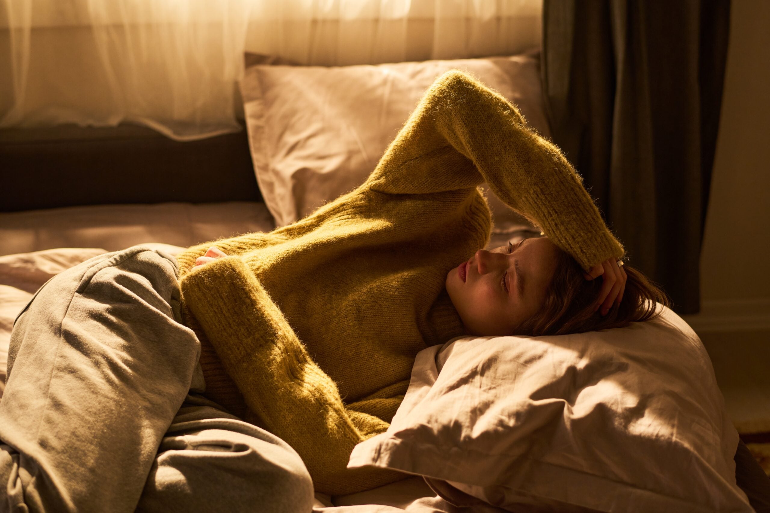 Woman struggling to let go of her thoughts and can't sleep.