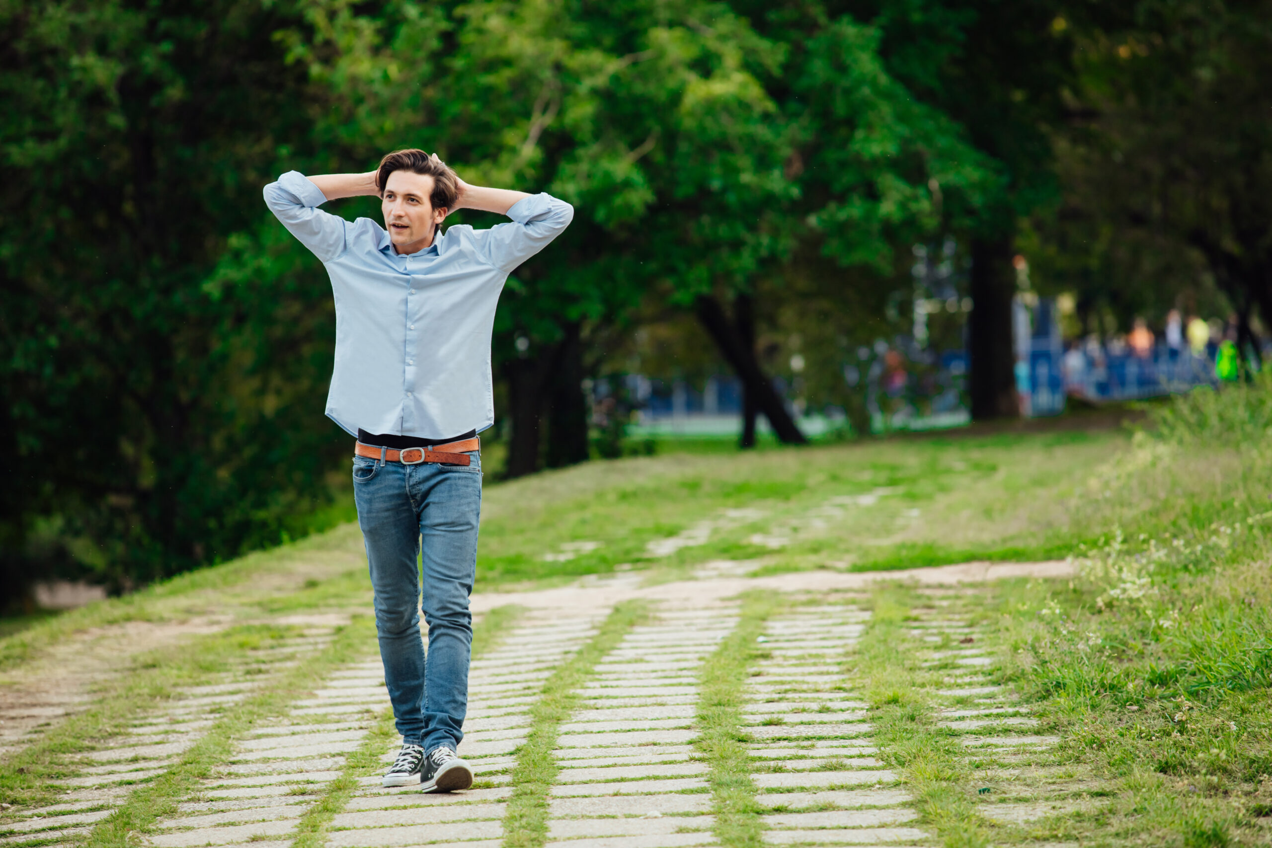 A man walking alone outdoors.