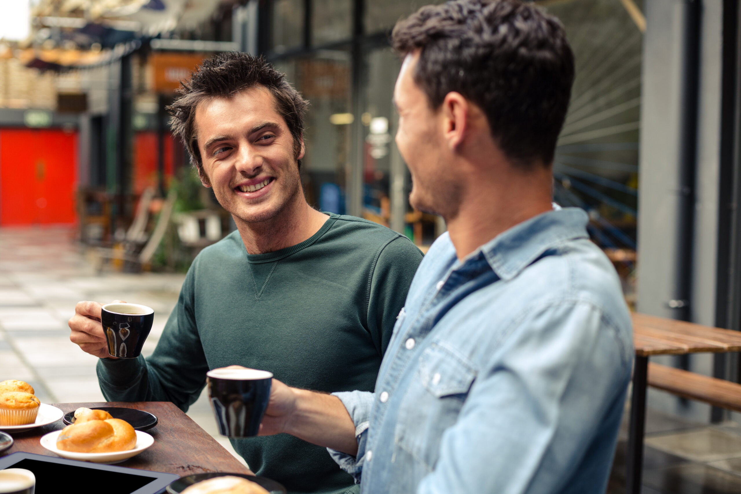 A man having coffee with a friend.