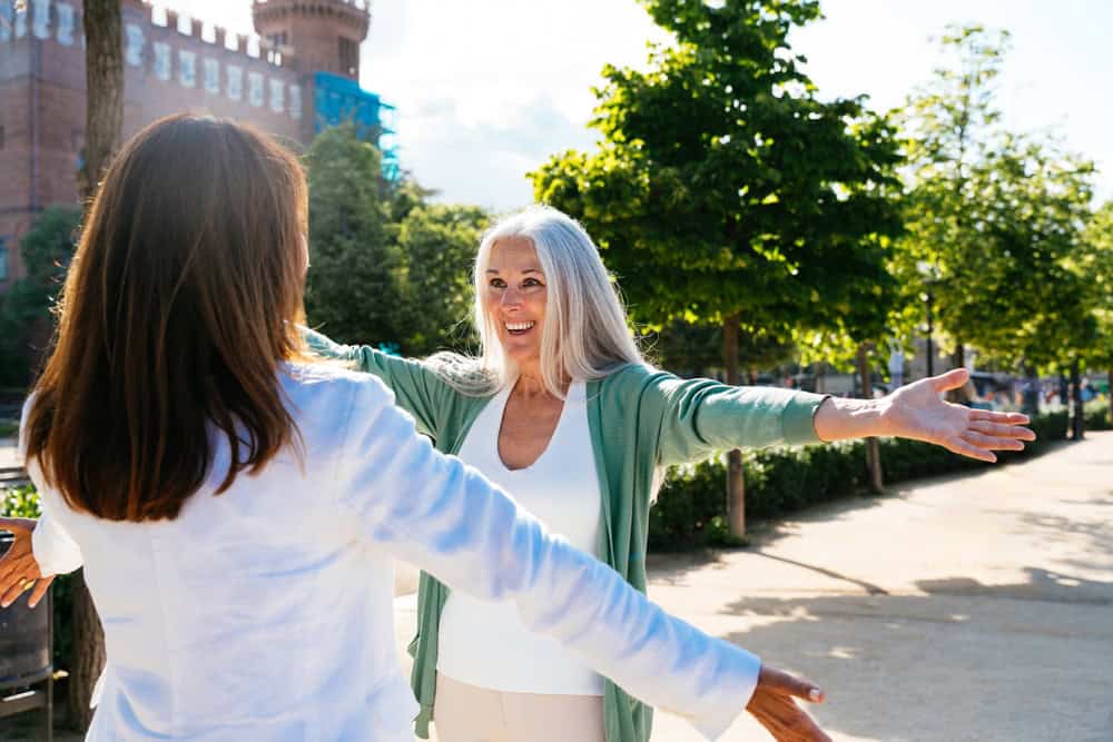 Beautiful senior women bonding outdoors