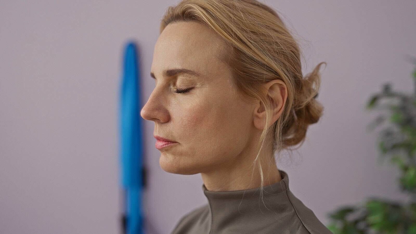 Pretty middle aged woman meditating