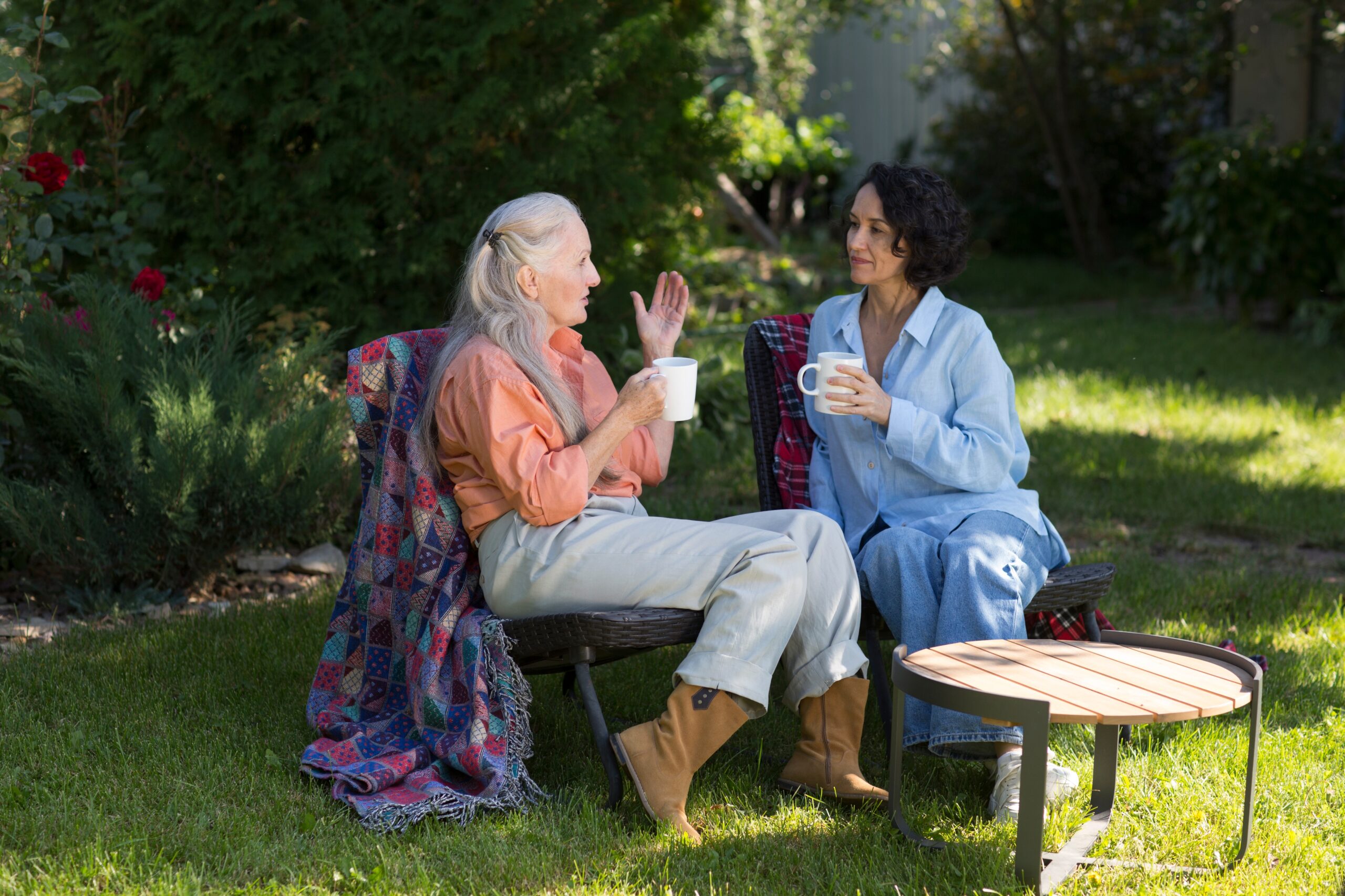 A woman with high emotional intelligence speaking with her friend in the garden.