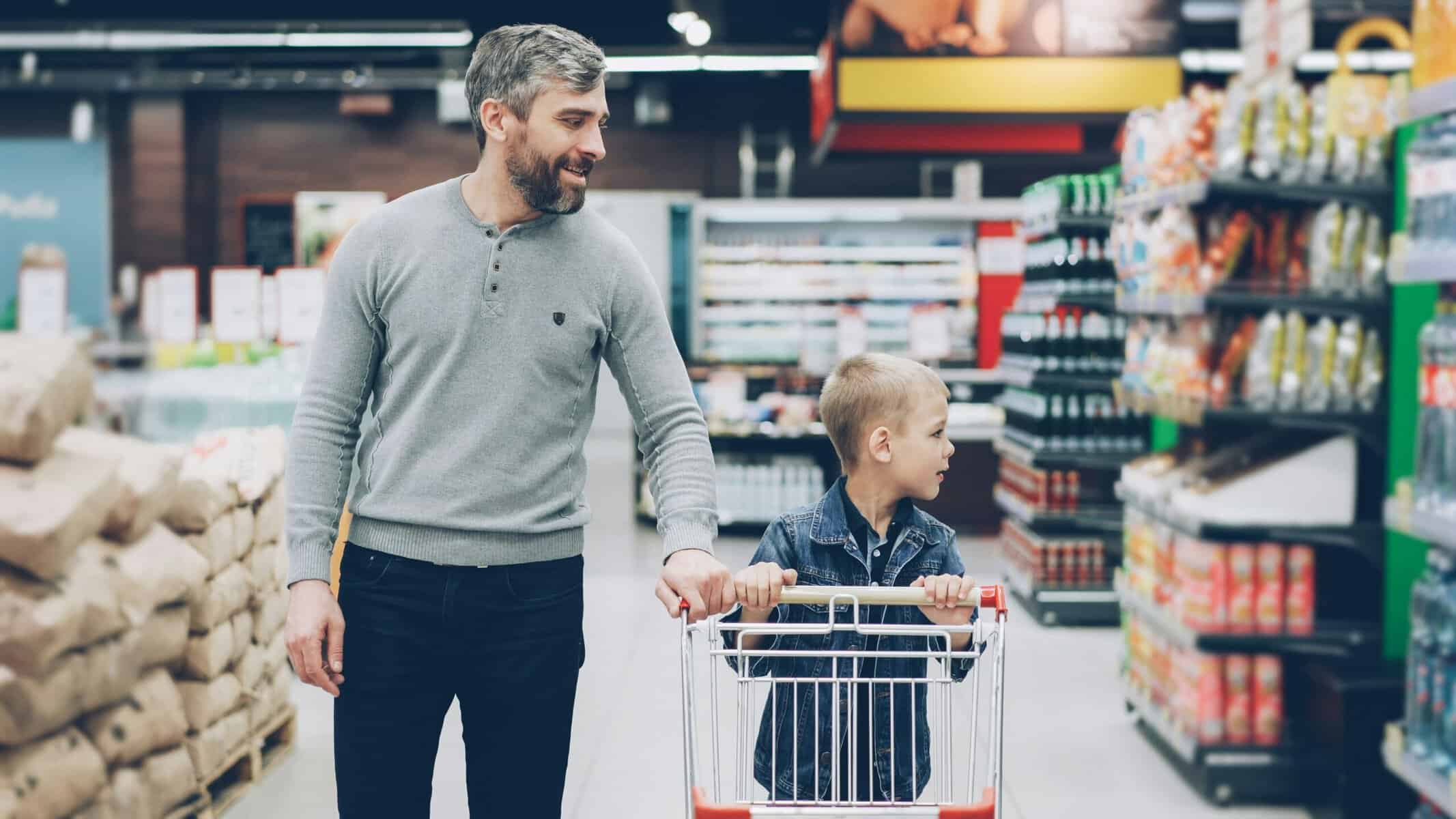 A father who was the responsible one as a kid grocery shopping with his son.
