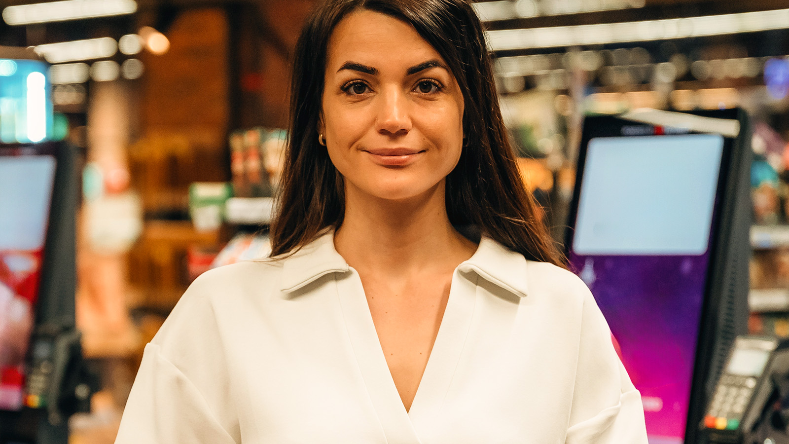 Woman at store checkout counter