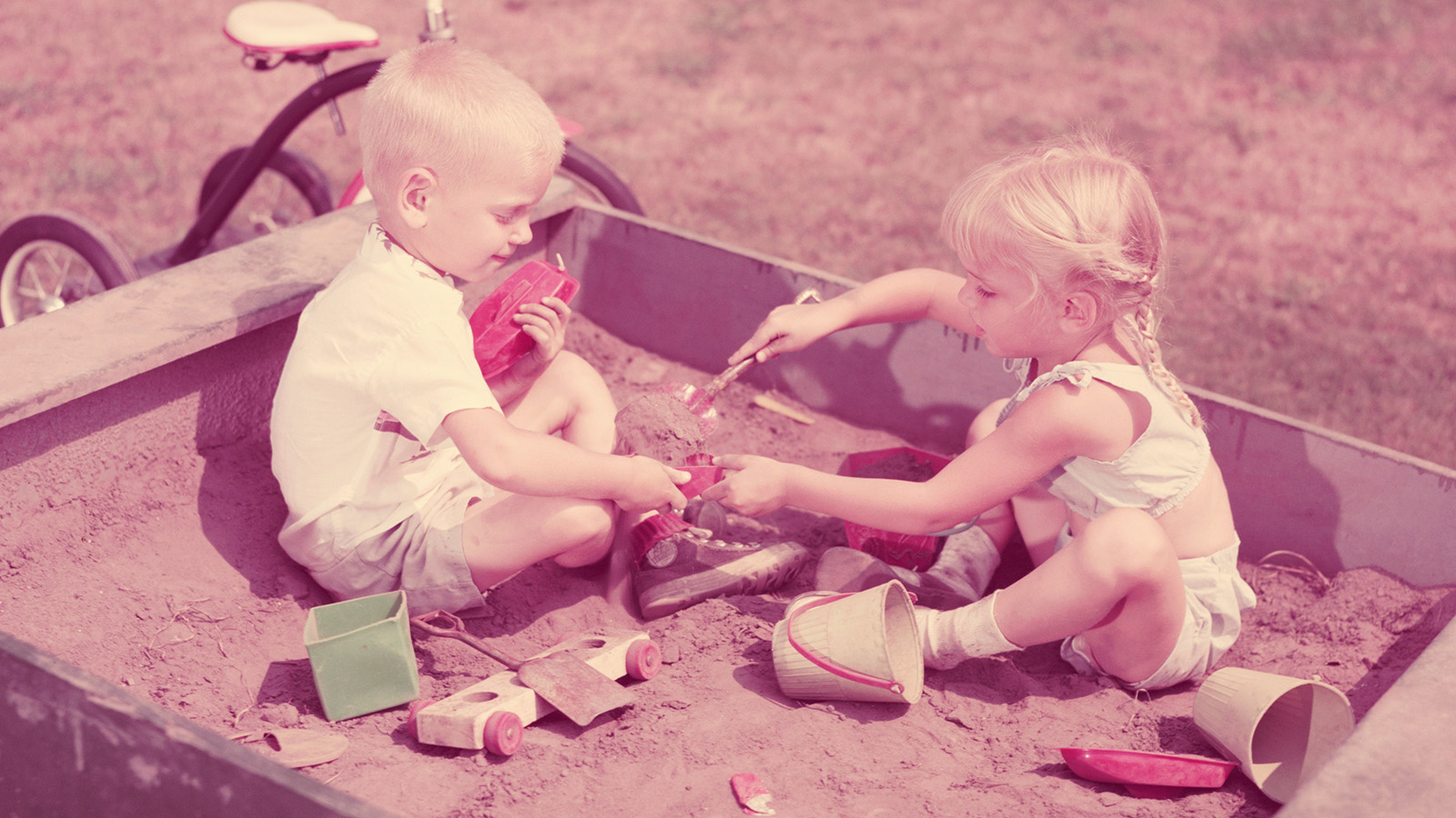 Vintage photo of children playing in sandbox