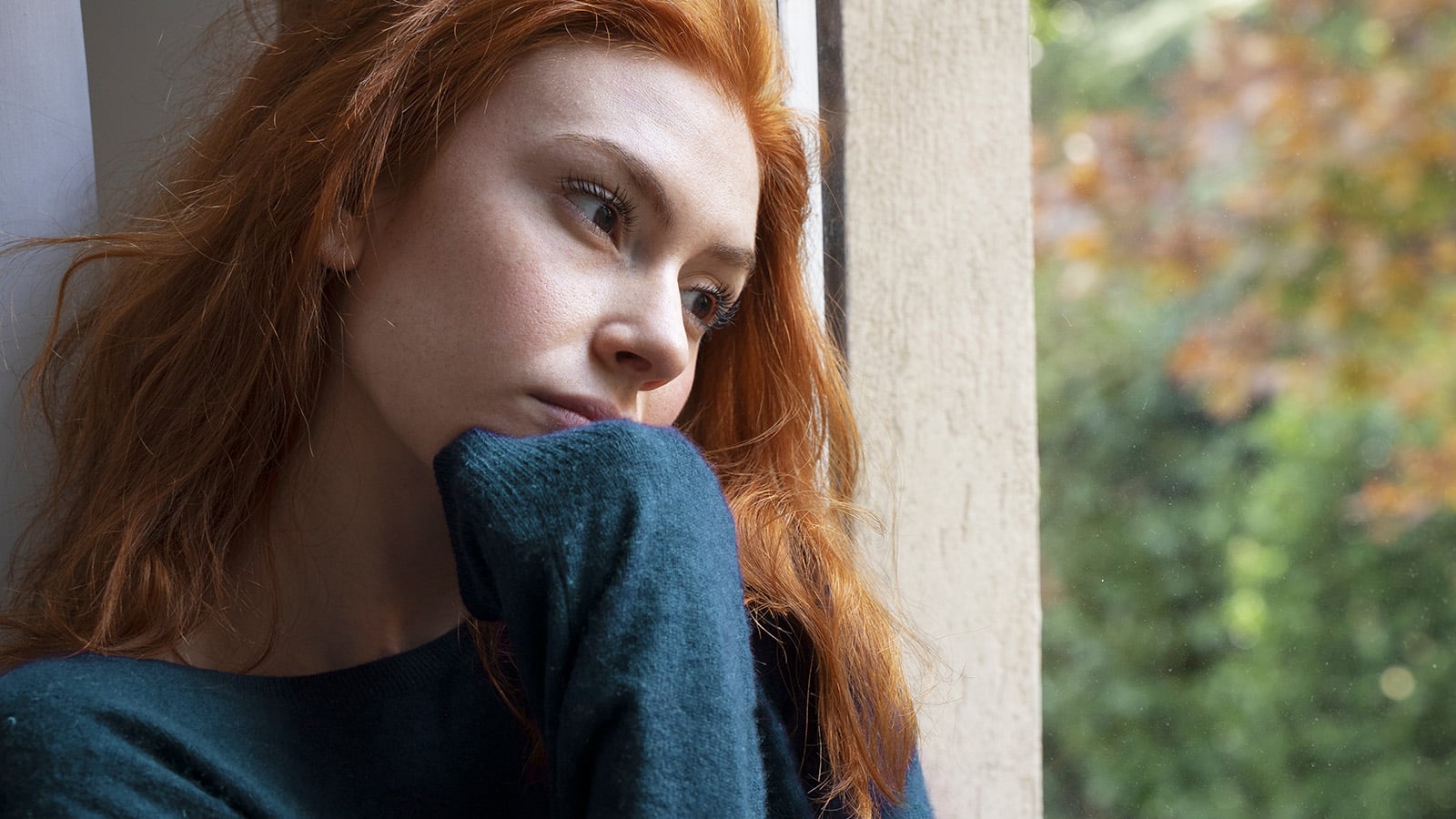 Sad woman feeling negative emotions alone at home