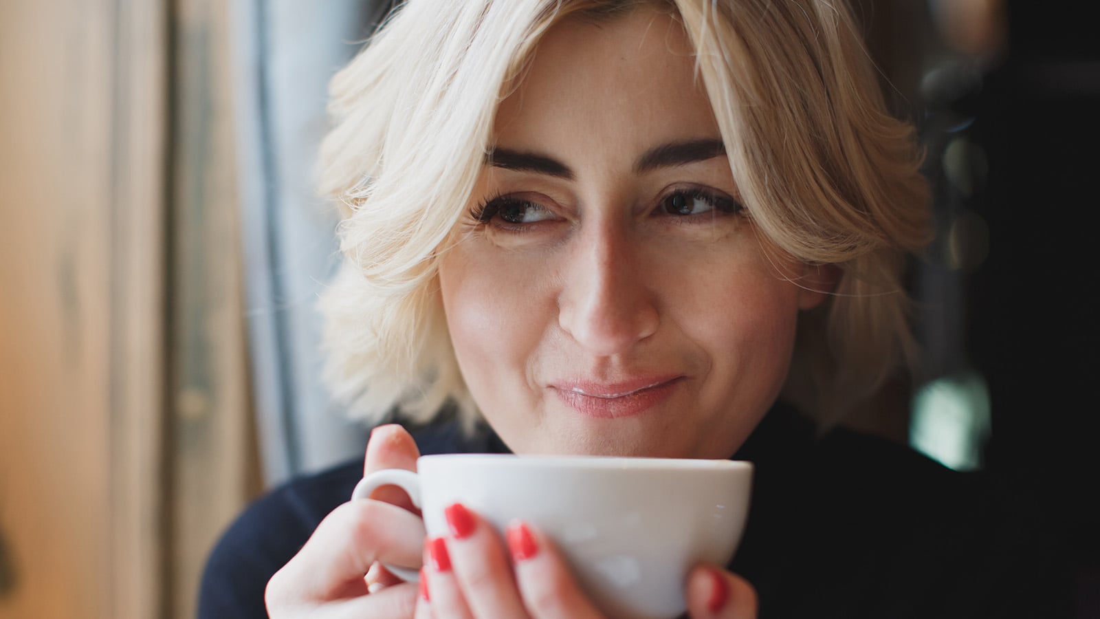 young woman sipping coffee
