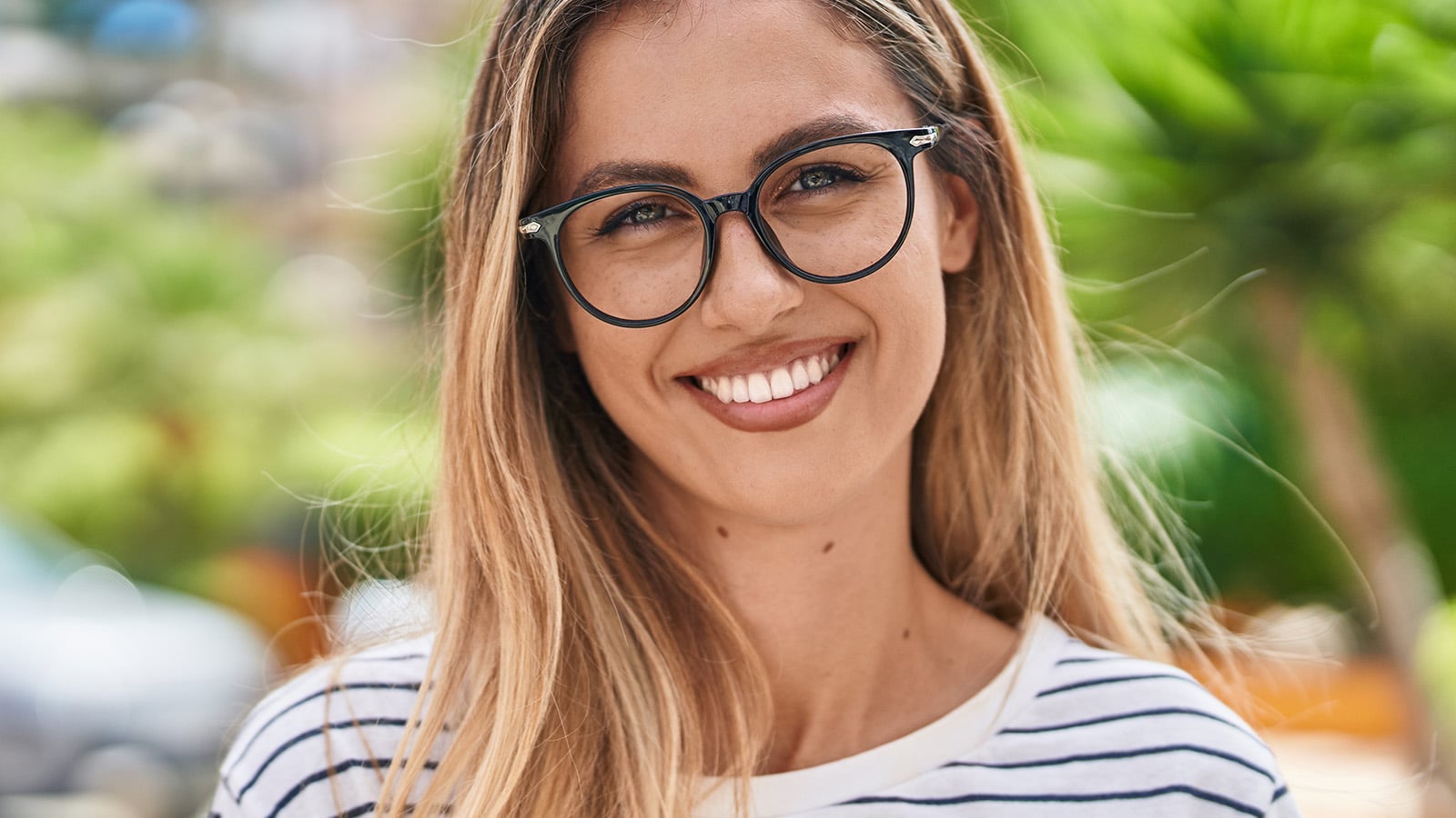 pretty girl with glasses smiling