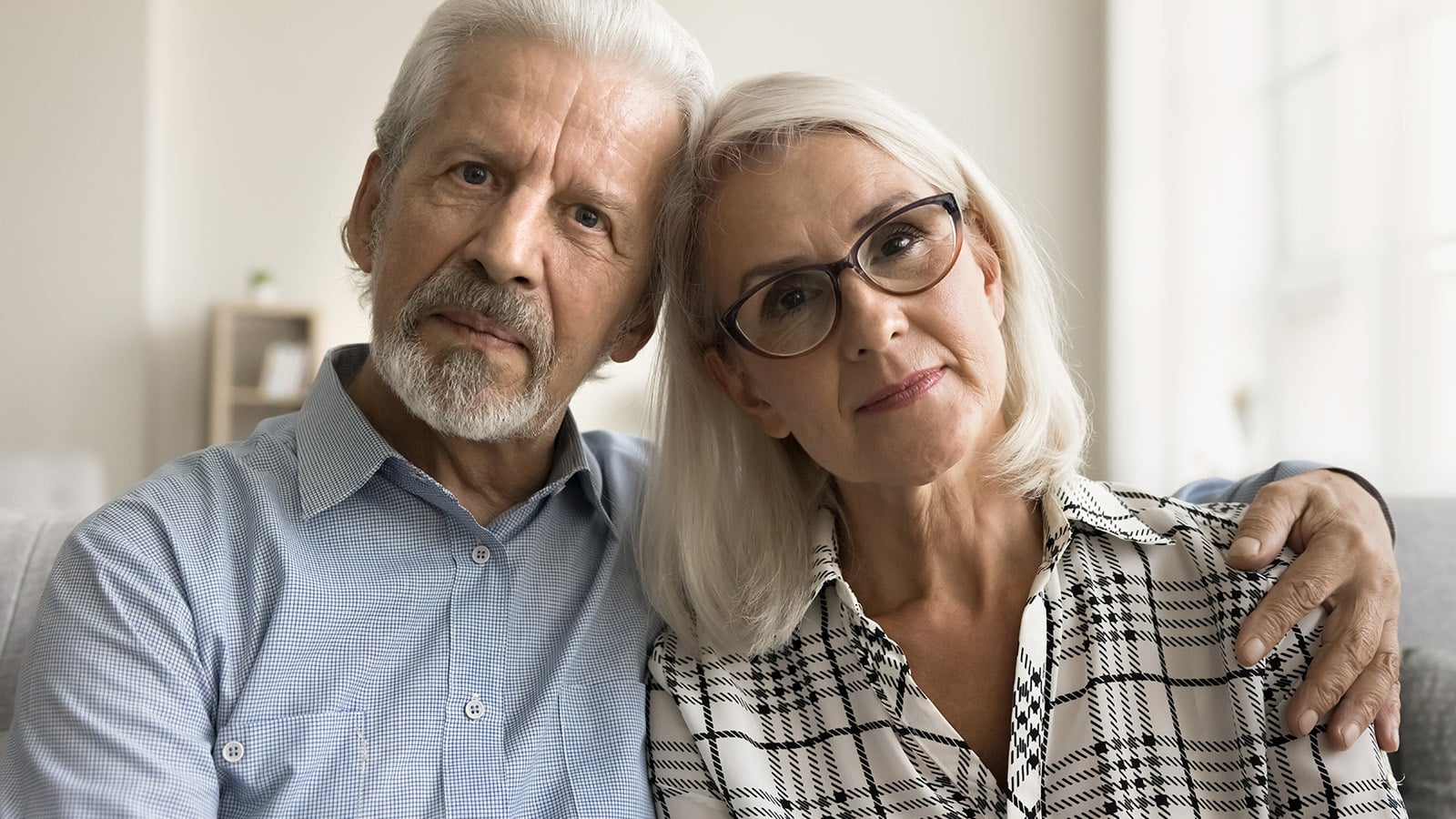 Older couple looking serious