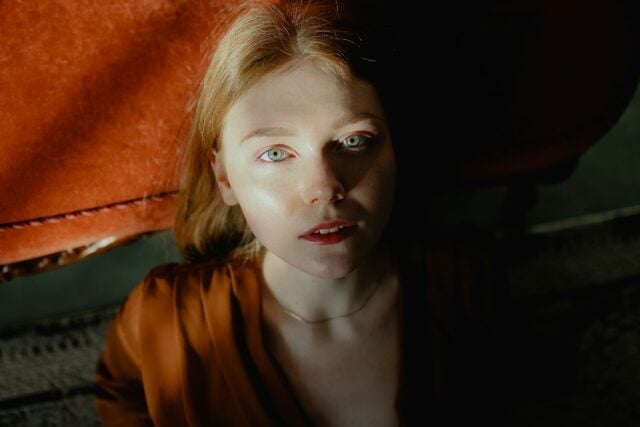 A person with fair skin and light eyes looking directly at the camera.