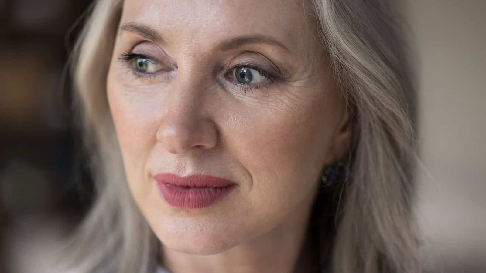 A middle aged woman thinking about her single life.