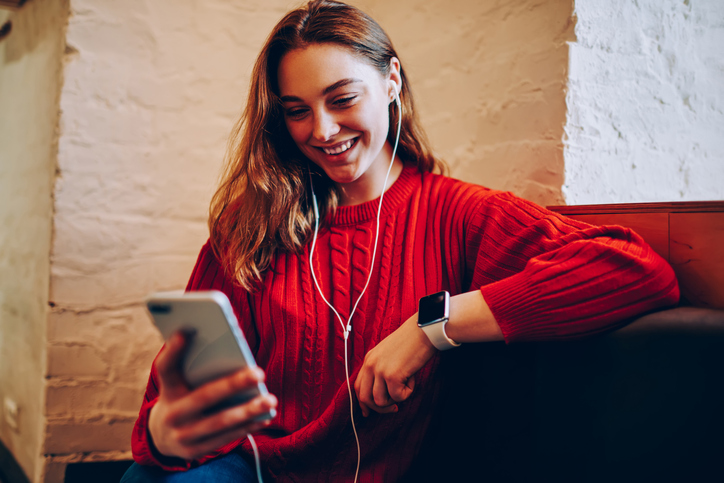 Young woman on her phone texting