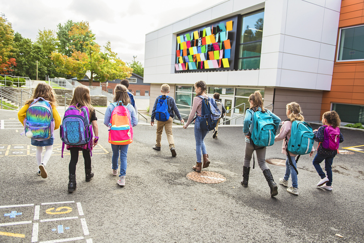 A group of kids going to school.