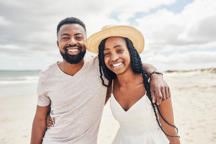 Portrait of an affectionate young couple enjoying their date at the beach