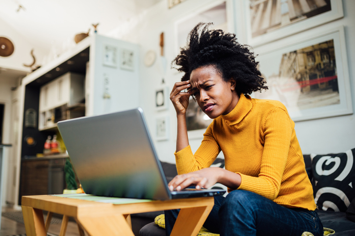 A woman sitting at her computer.