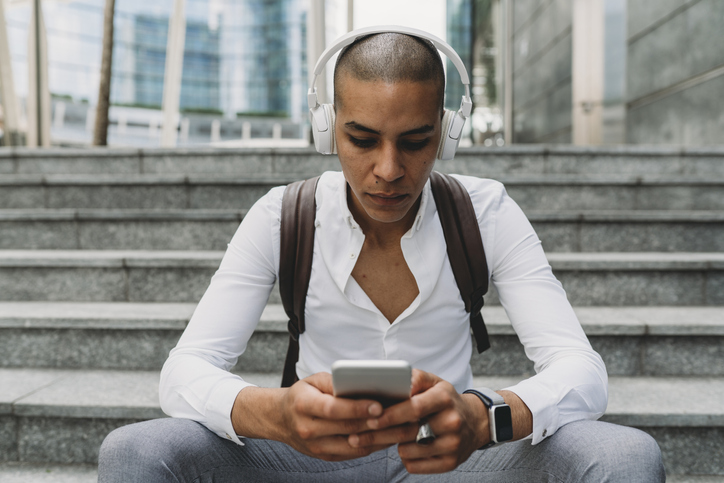 Young man texting on his phone