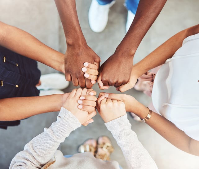 Holding hands, faith and prayer support group of people in a community.
