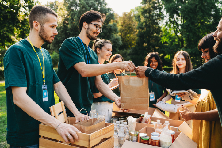 Volunteers are working together at a humanitarian aid project.