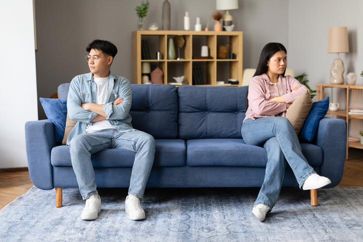 couple sitting upset and fighting