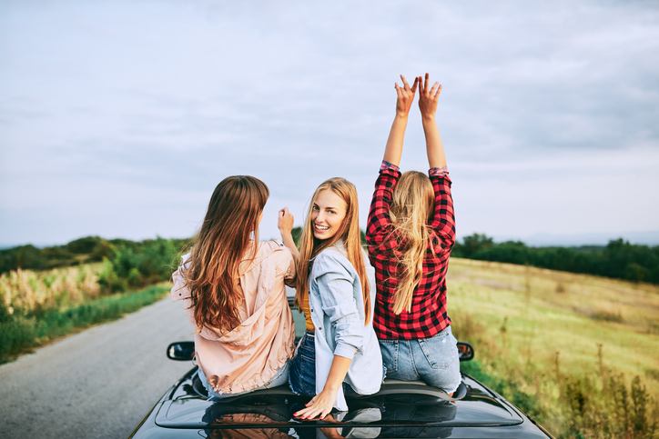 Group of teenagers riding in the car.