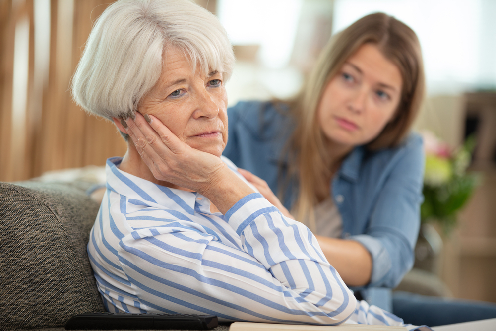 Mother and daughter having a serious conversation at home.
