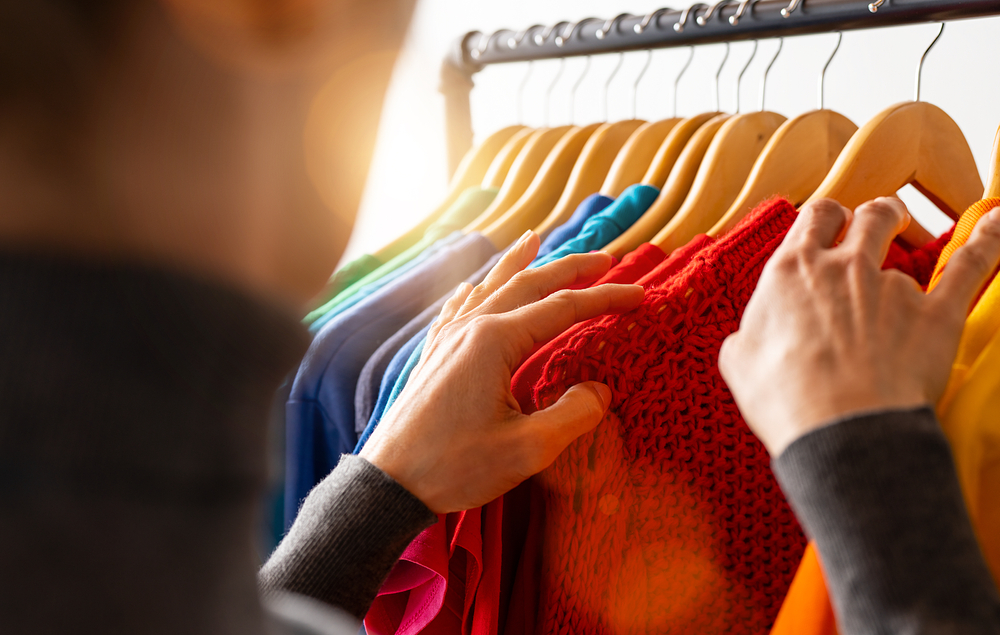 Clothes hanging in a closet.