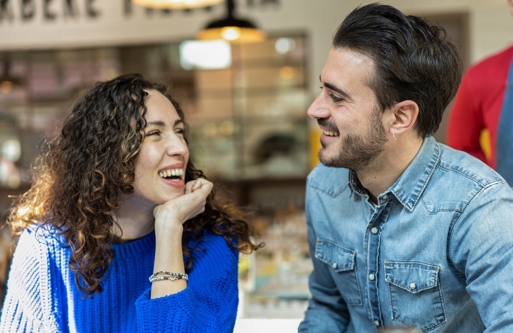 A happy young, good looking couple looking at each other with love