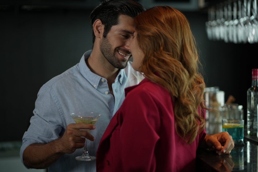 A young couple out and about having fun and flirting with each other