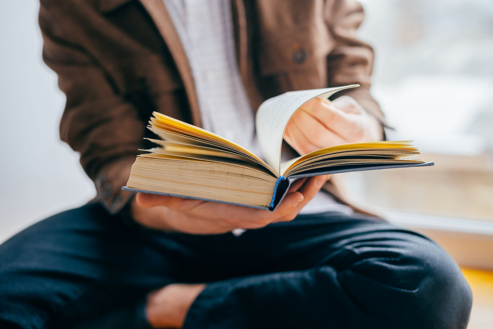 A man reading a book.