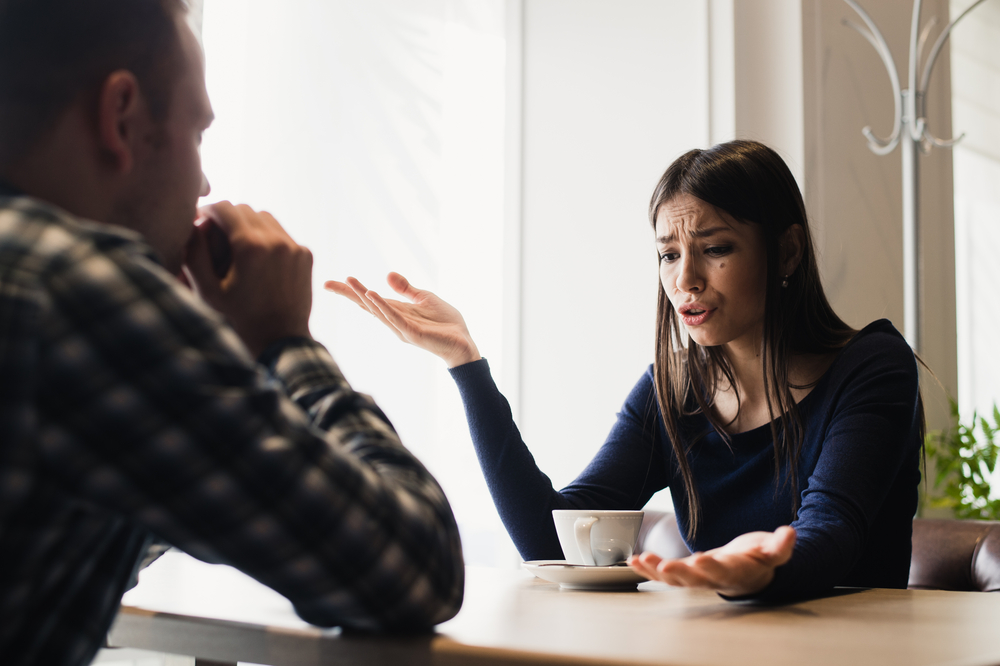 A young couple arguing at home