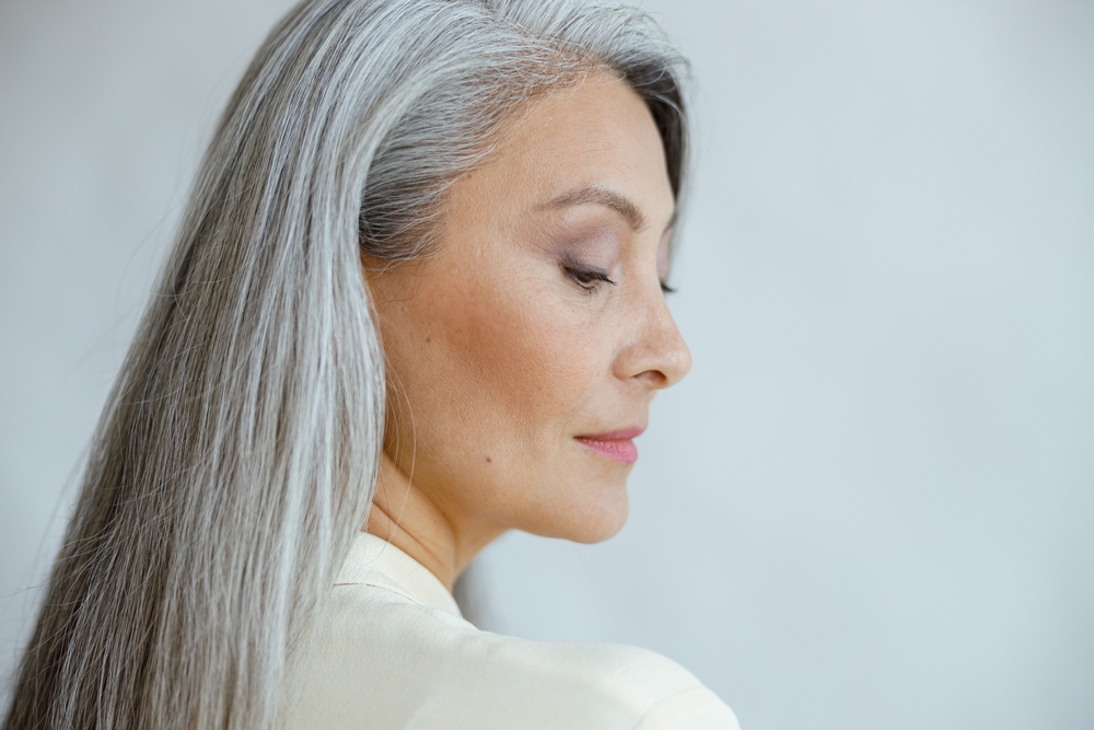 A very pretty middle aged woman with gray hair
