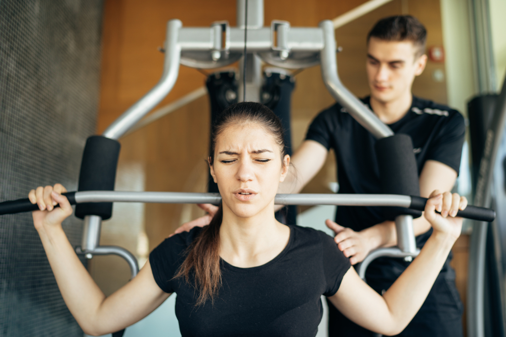Two people working out at the gym.