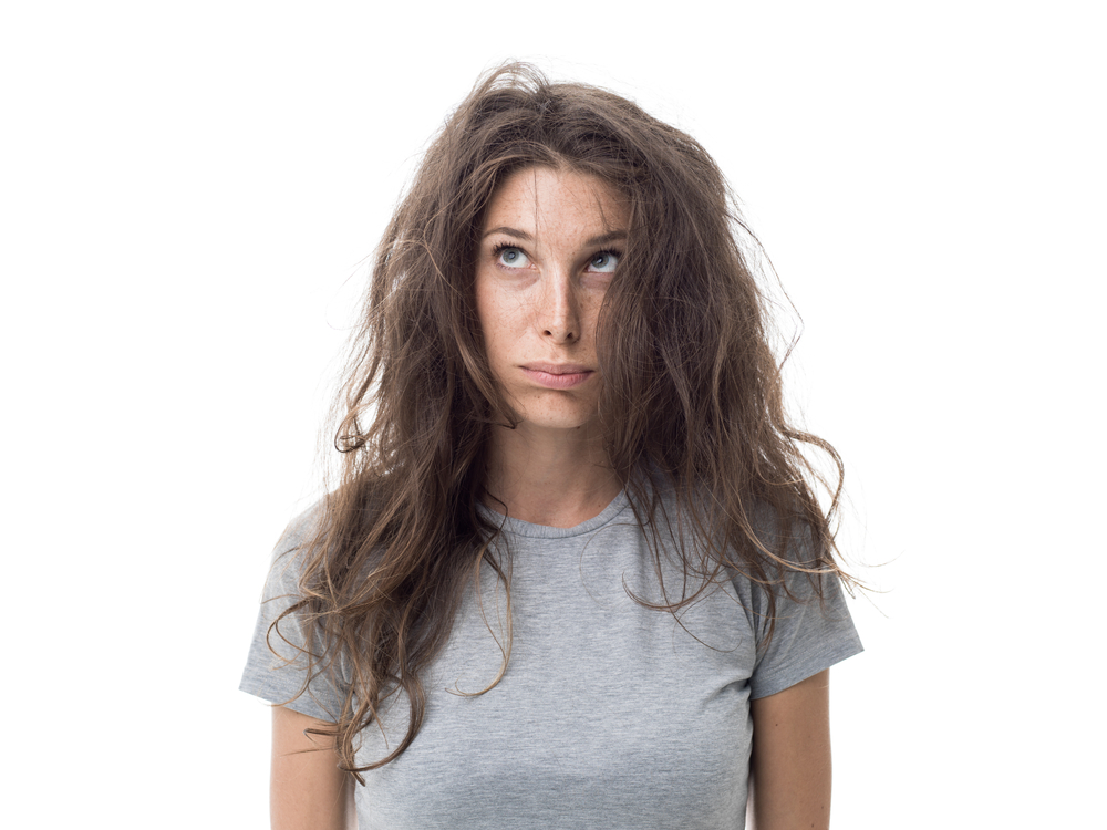 Young woman looking disheveled.
