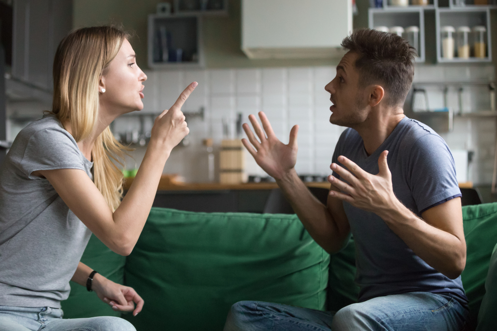 An angry millennial couple having a fight
