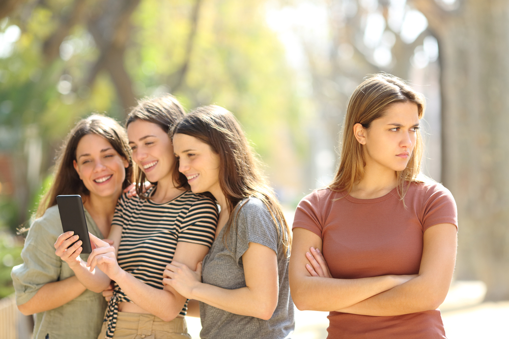 Angry woman being ignored by her friends