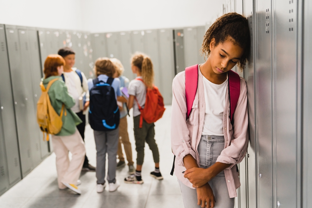 Lonely Sad child in the hallways at school
