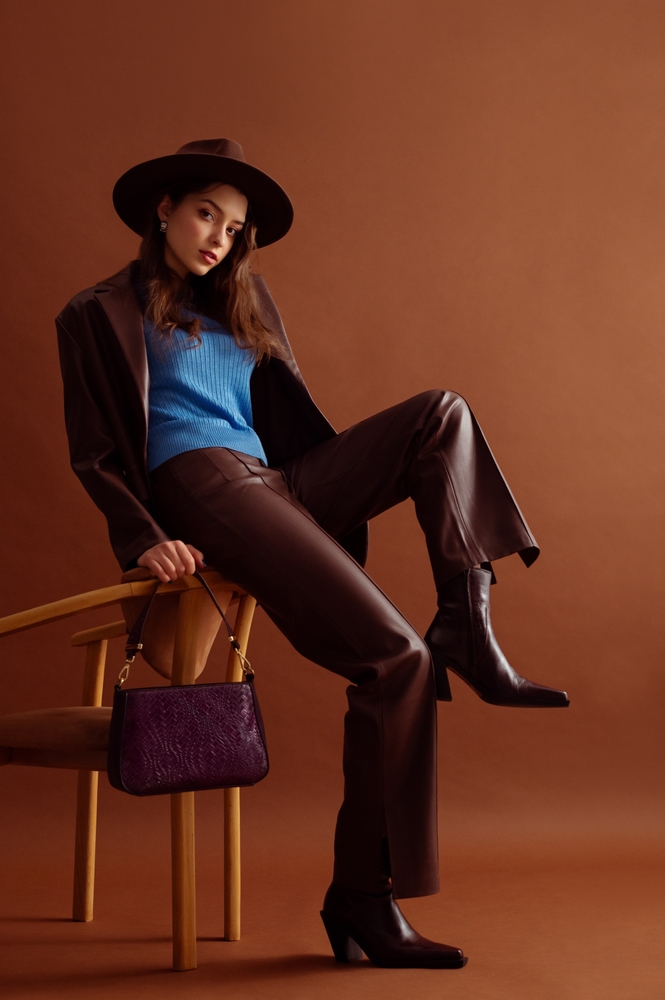Fashionable woman wearing leather pants.