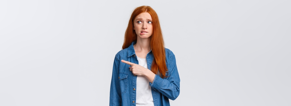 An awkward, timid and nervous young redheaded woman