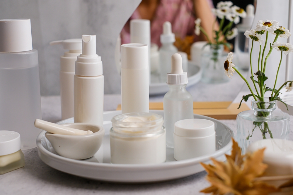 A collection of skincare, cosmetics and beauty products in white containers