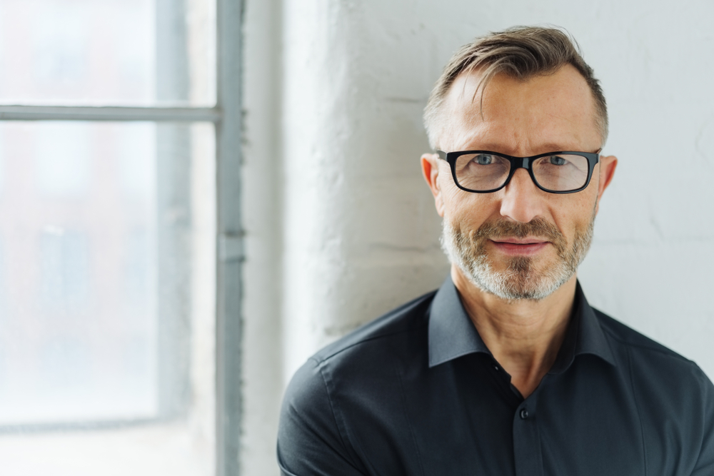 Man with his glasses on.