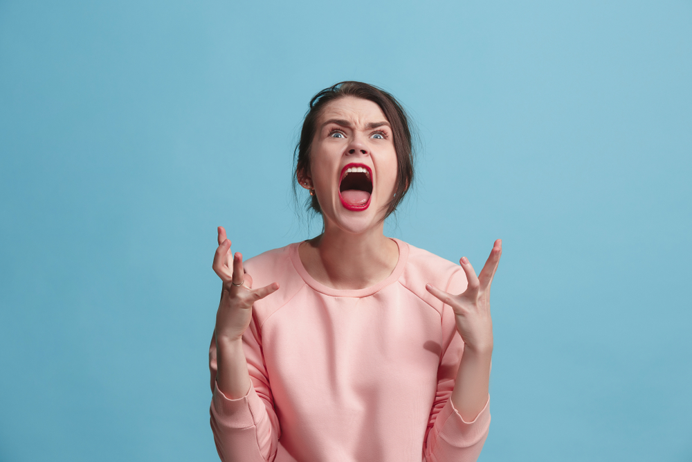 An angry woman yelling.
