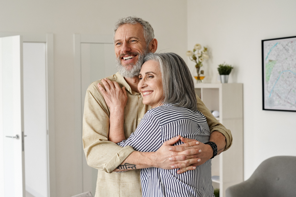 A happy senior mature couple holding each other