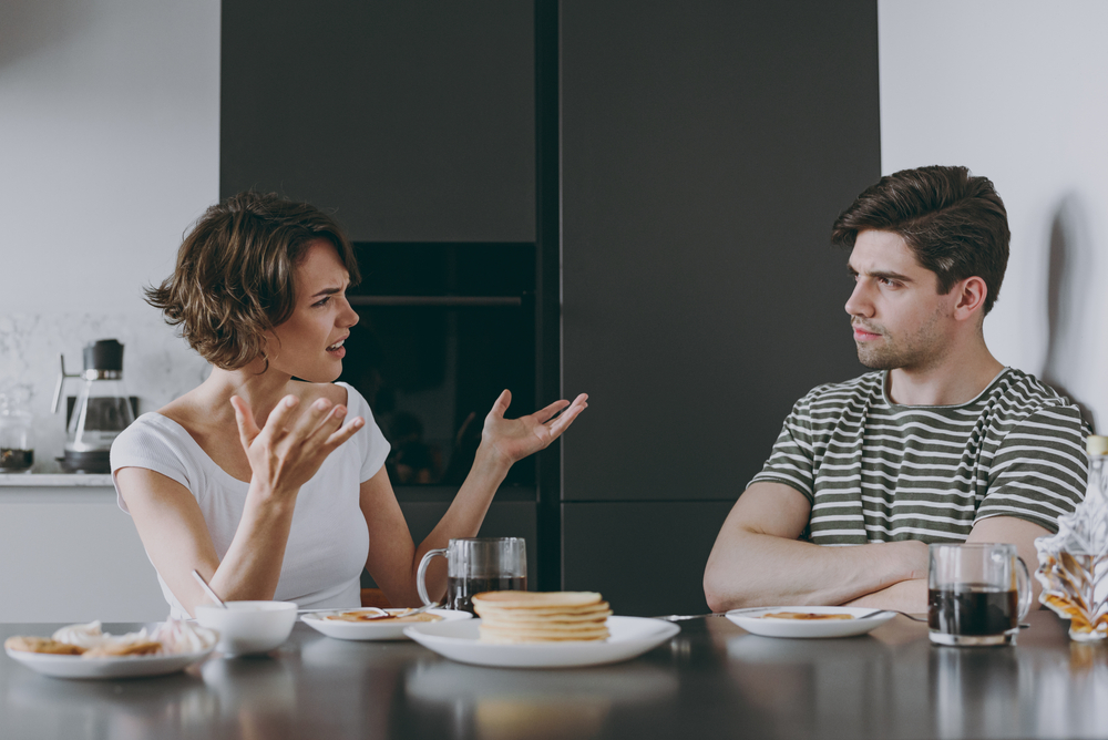 A sad young couple having a sad conversation