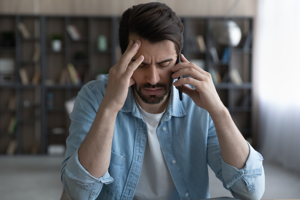 Stressed man on the phone