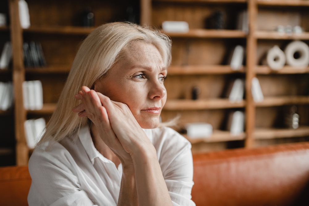 Woman feeling stressed at home. 