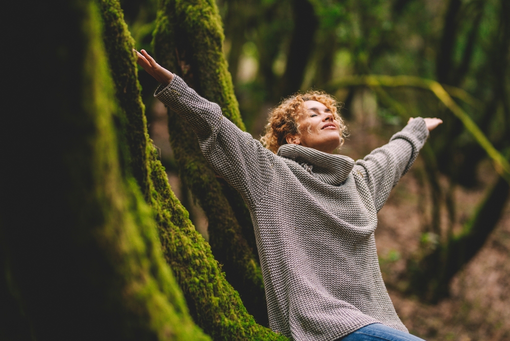 An overjoyed happy woman in nature